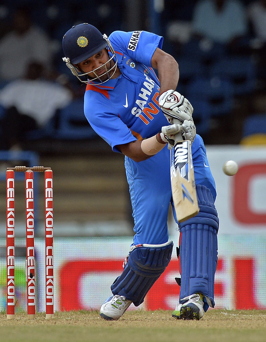 Rohit Sharma lofts the ball into the leg side