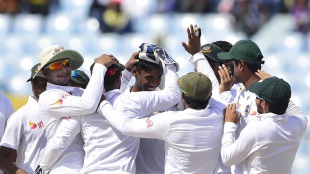 Mustafizur Rahman is mobbed by his team-mates after he removed JP Duminy, Bangladesh v South Africa, 1st Test, Chittagong, 1st day, July 21, 2015